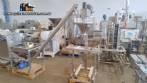 Sistema de llenado de polvo con transportador de silo de tornillo y llenador de tornillo