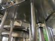Llenadora rotativa gravimtrica de acero inoxidable con cabina