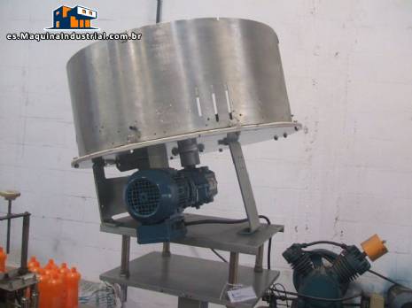 Alimentador de tapas y rotaci�n del posicionador